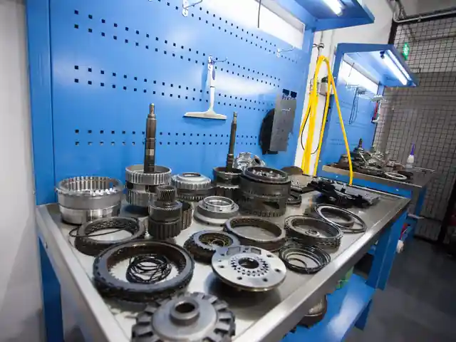 Gearbox clutch packs and gear sets laid out for inspection